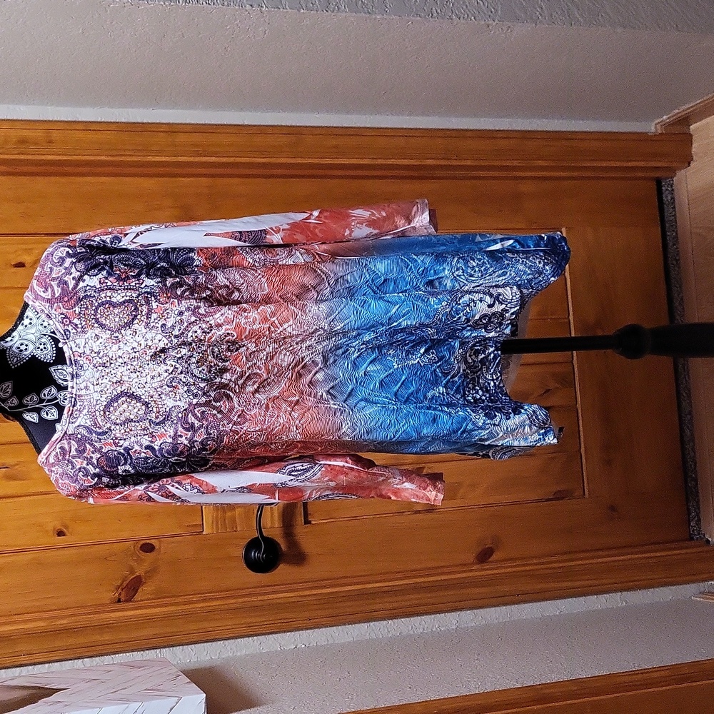 NWOT Multi-colored top with Multi-colored sequins. Size XL
